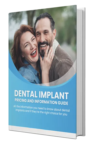 Smiling couple in casual setting, dental implant pricing guide book cover displayed.
