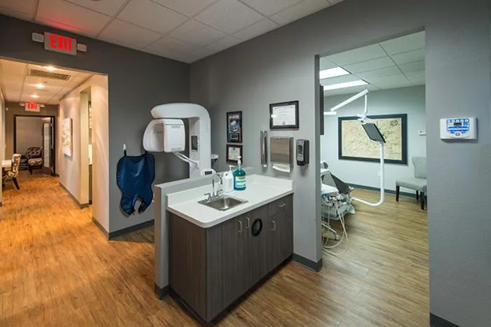 Modern dental office reception area with treatment rooms and professional workspace at Memphis dentures clinic.